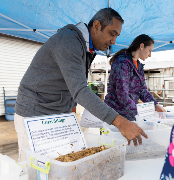 Two Instructors at a tabling booth