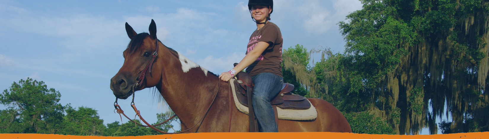 Girl riding horse