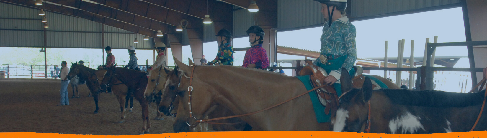 riders in an arena